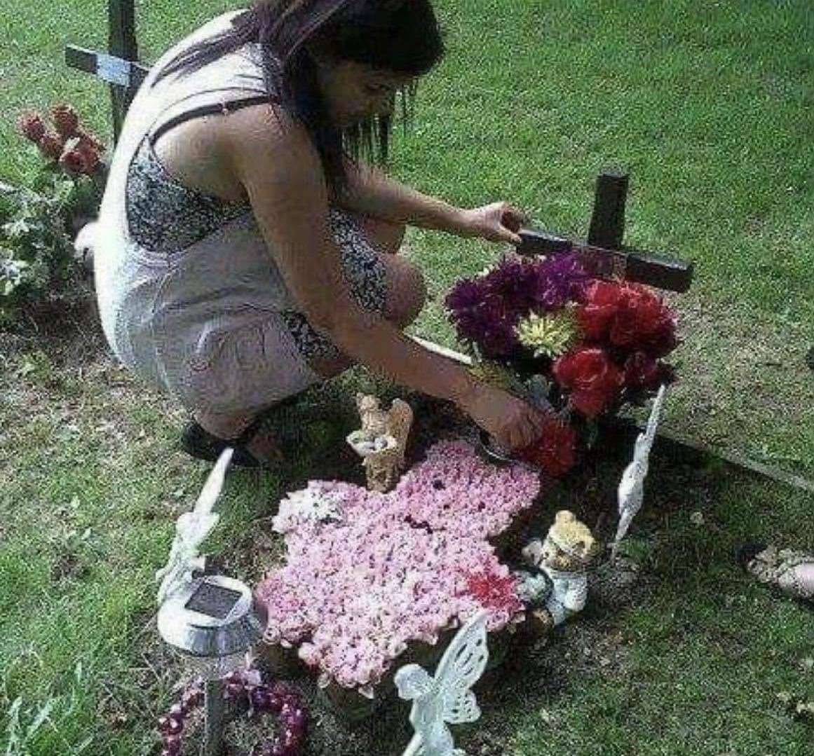 Natasha Alleyne, by the grave of her daughter Indie Rose who was stillborn in 2010. Picture: Jessica Alleyne