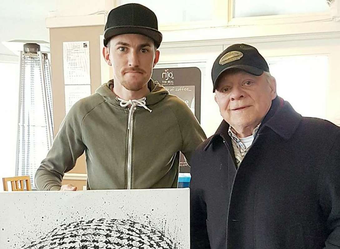 Artist Ben Stokes standing with acting legend Sir David Jason