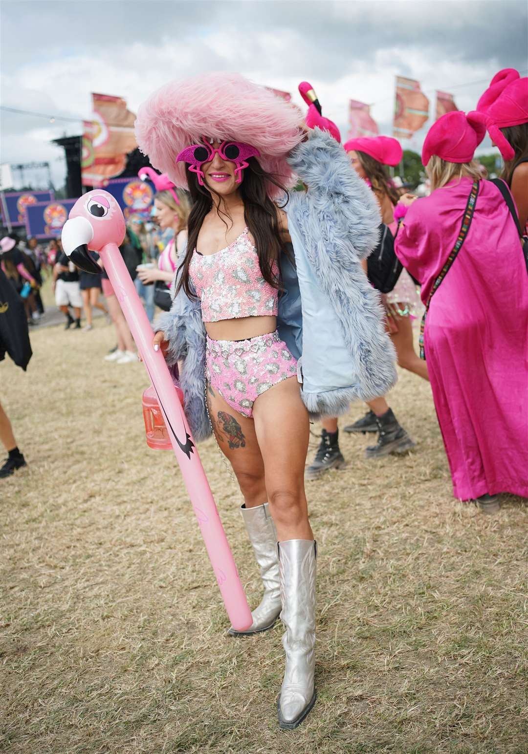 Festivalgoer Saira Biruta was dressed in a flamingo costume (Yui Mok/PA)