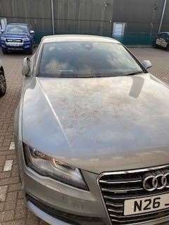 Cars covered in dust near the M2 Citylink site