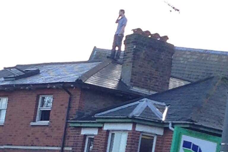 A man on the roof of a building in London Road in Maidstone. Picture: Jack Lambert