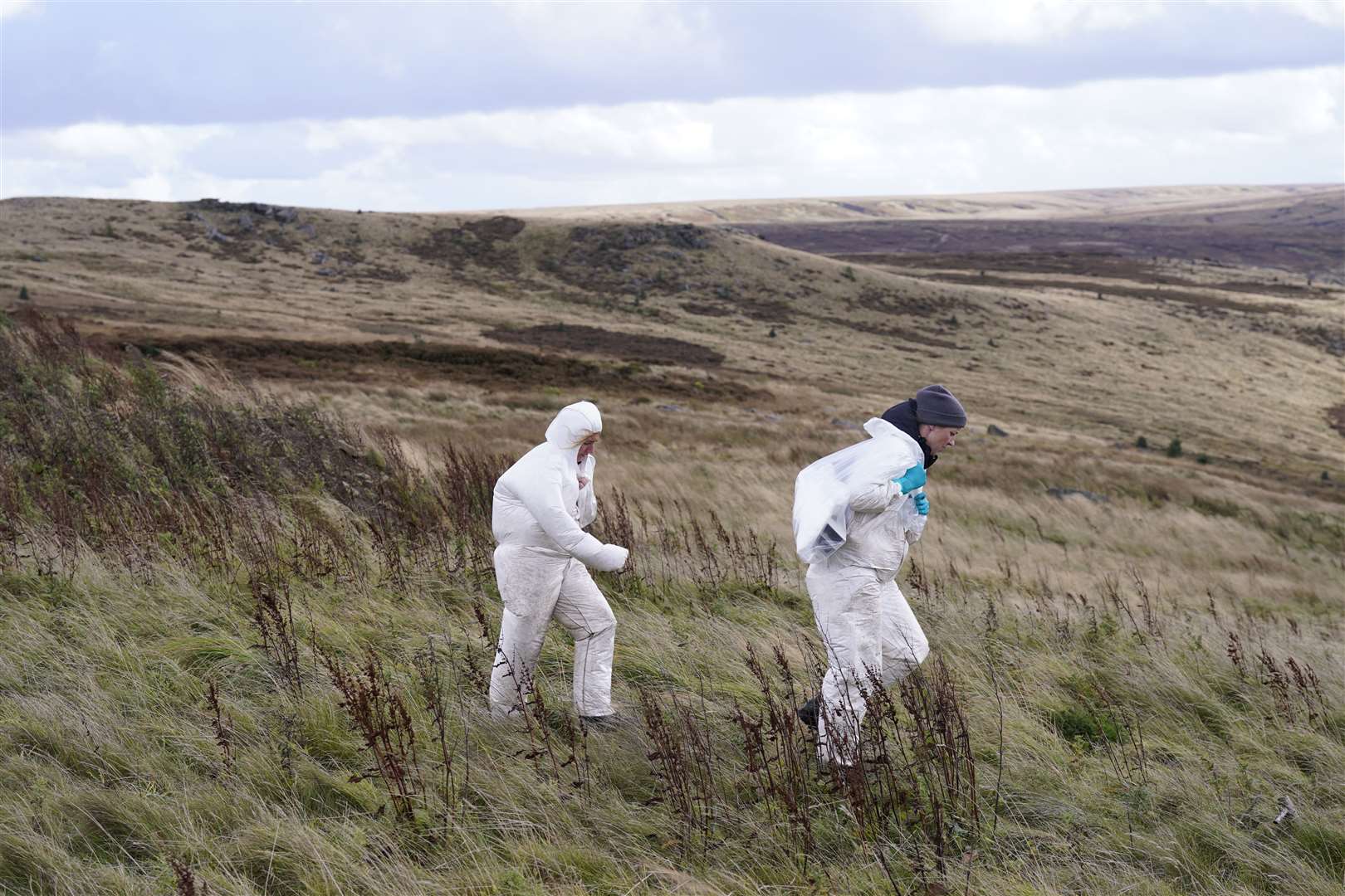 Officers in forensic suits on Saddleworth Moor (Danny Lawson/PA)