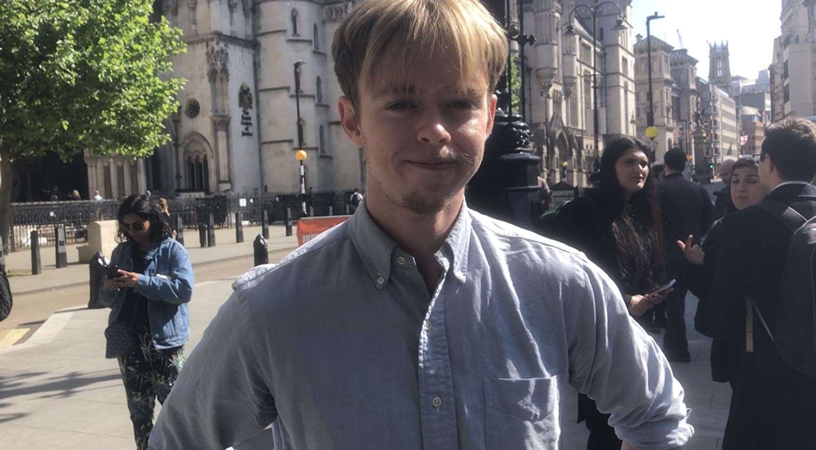 Daniel Amery joins students gathered outside the High Court (Lauren Shirreff/PA)