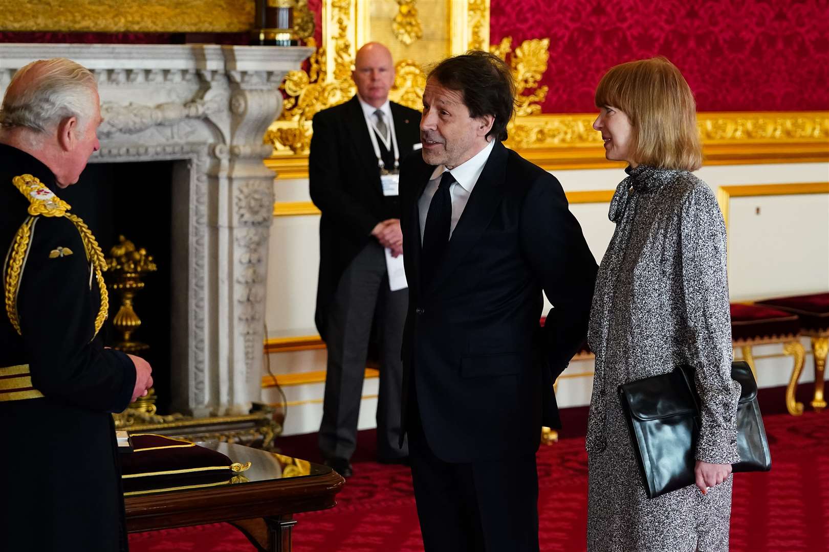 Designer Peter Saville is made a CBE (Commander of the Order of the British Empire) by the Prince of Wales at St James’s Palace (Aaron Chown/PA)