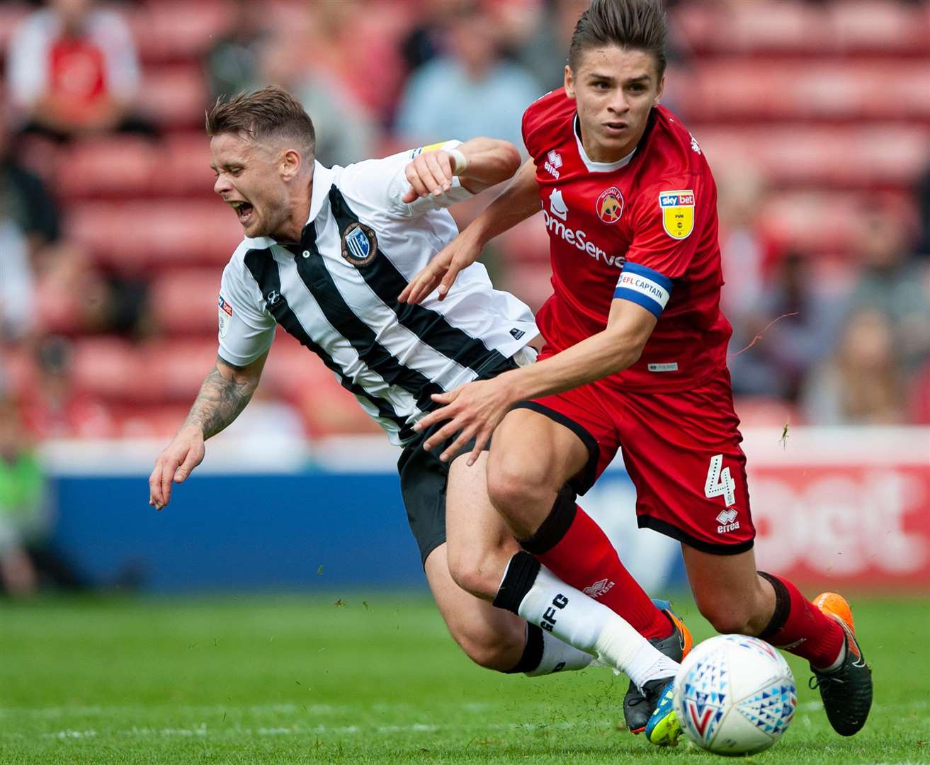 Mark Byrne goes down under a challenge from George Dobson during the last meeting with Walsall Picture: Ady Kerry