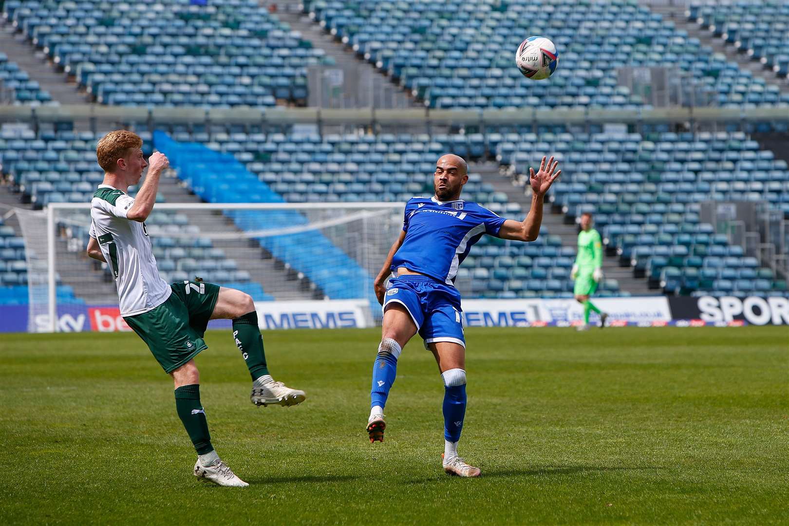 Ryan Law up against former Gills winger Jordan Graham at Priestfield in 2021 Picture: Andy Jones