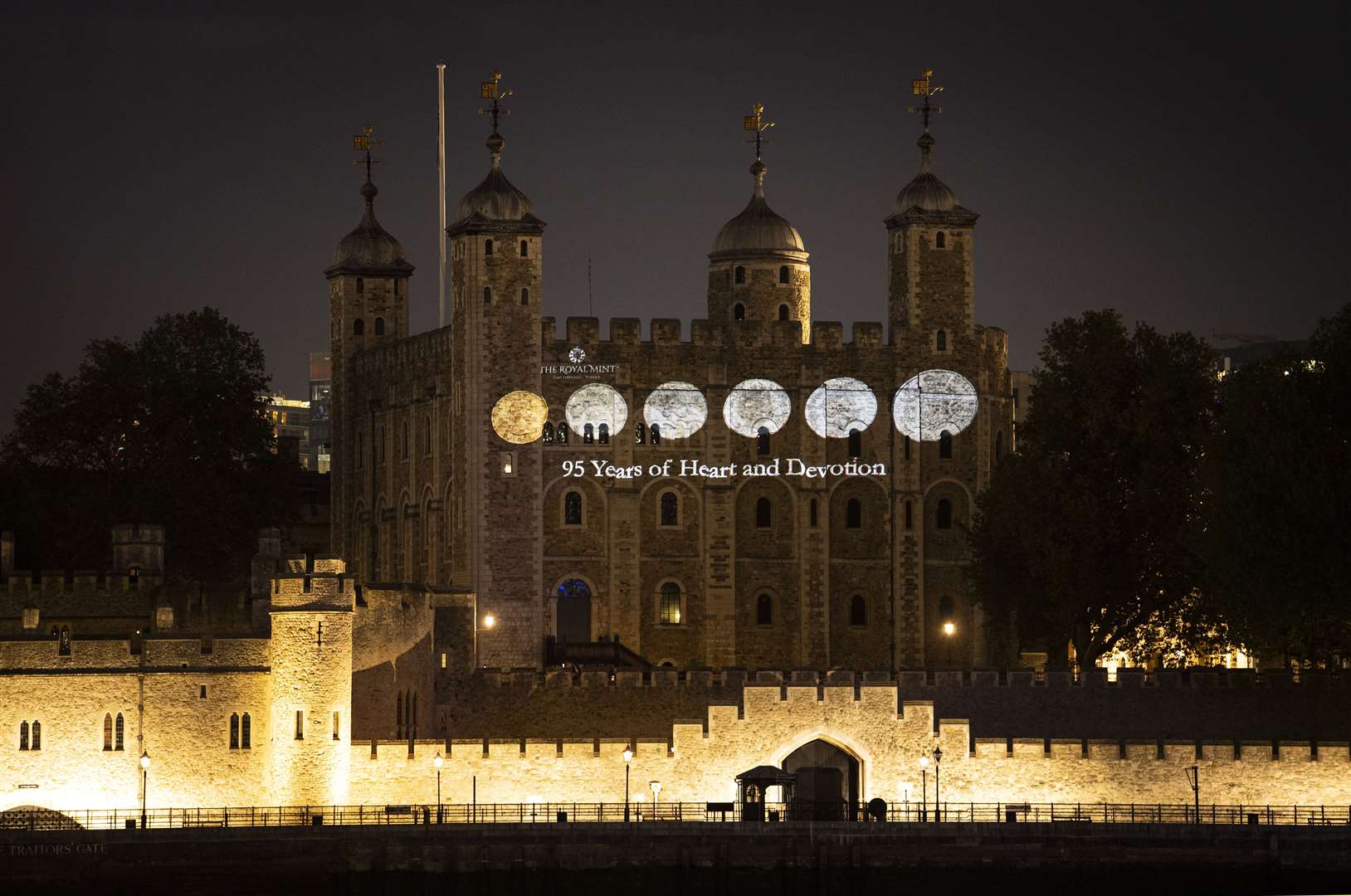 Projects of the coins fill the Tower wall (Doug Peters/PA)