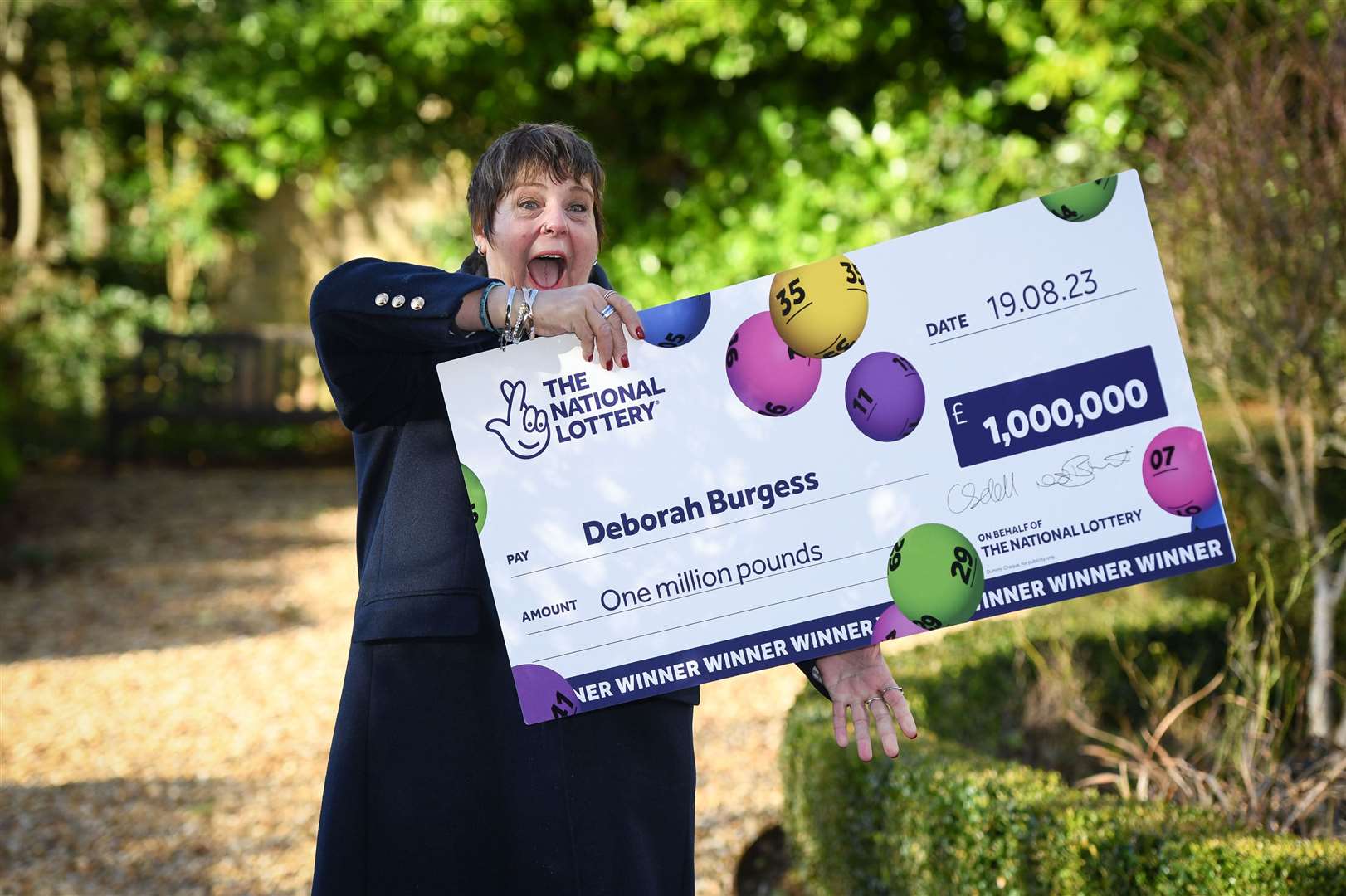 Deborah Burgess had no idea for months she had become a millionaire after falling ill and not checking her emails (National Lottery/PA)