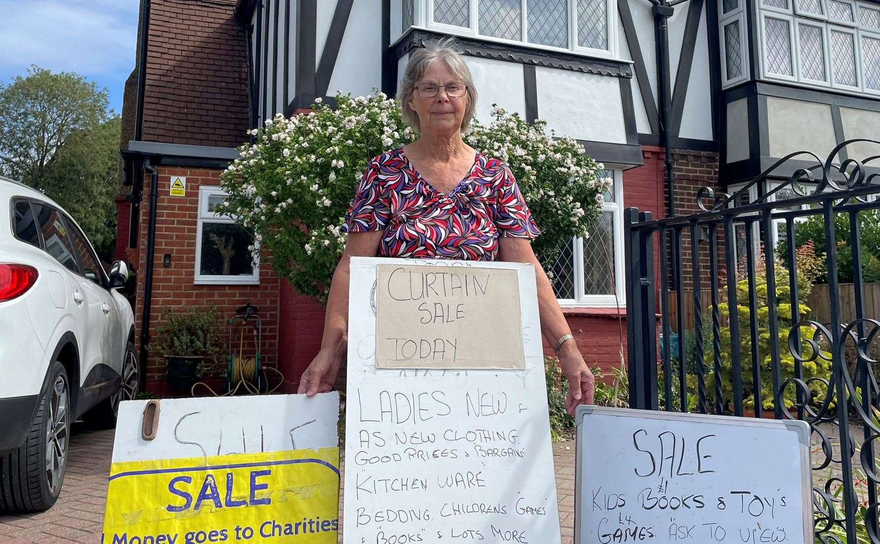 Barbara Hatton with the sale signs outside her home in Walderslade Road, Chatham