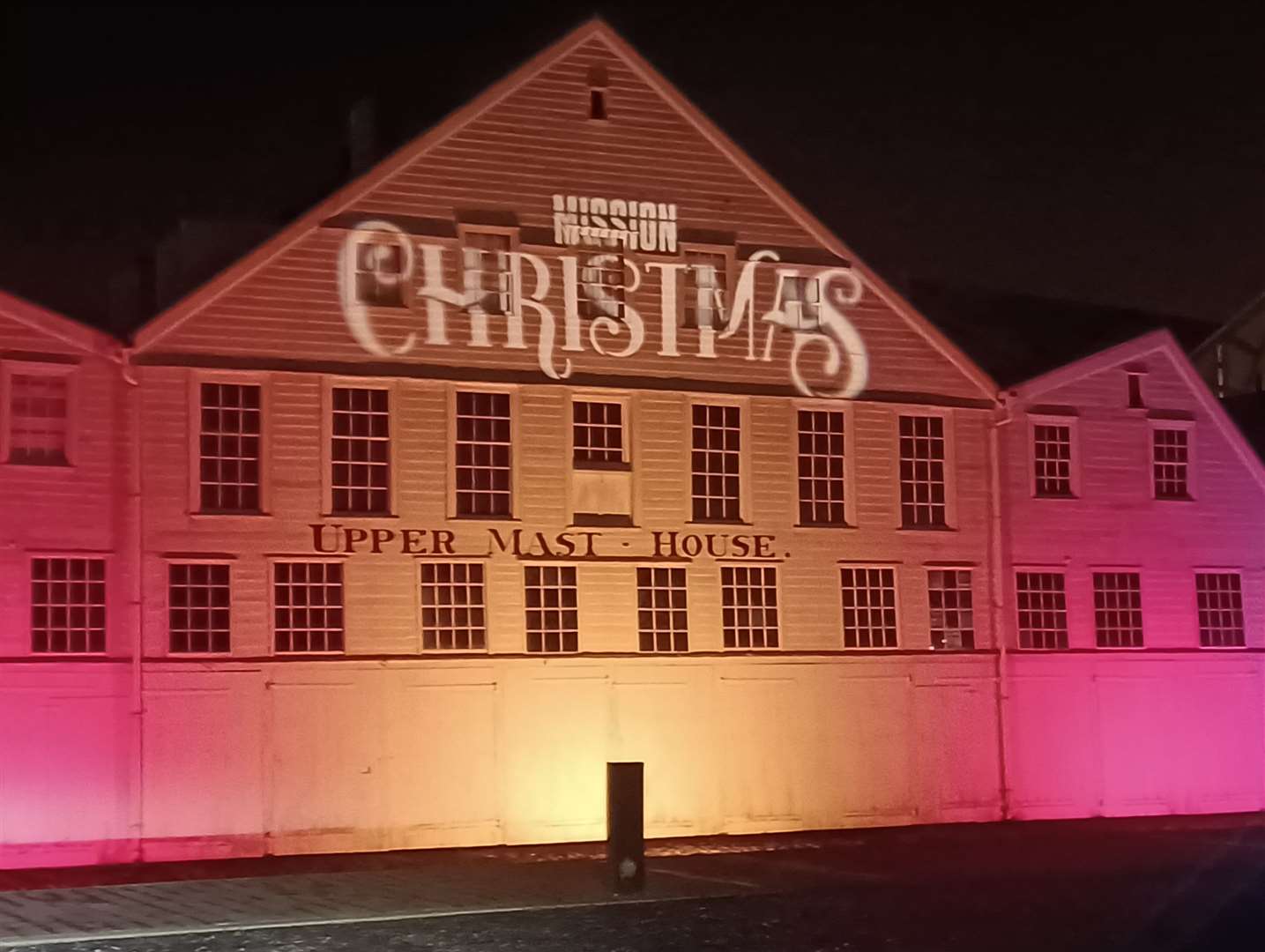 Chatham Dockyard is lit up as you arrive