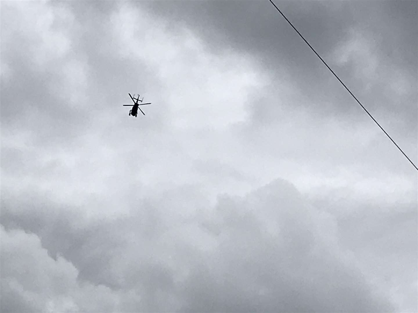 A police helicopter can be seen circulating the River Medway
