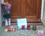 Tributes laid outside Ms Robinson's home
