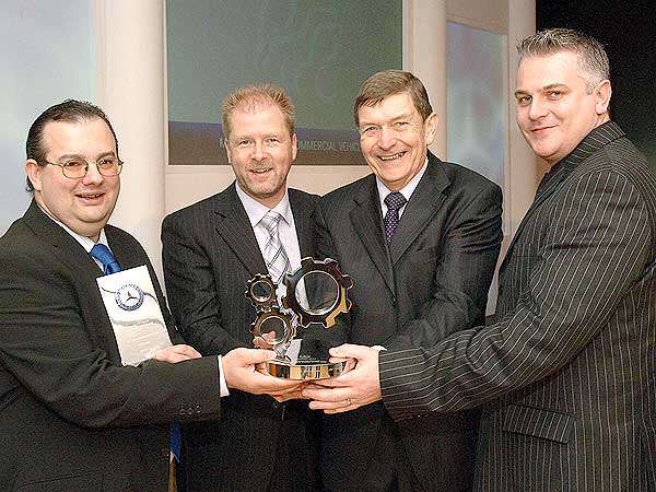 Sparshatts' Dealer Principal David Jones, second right, with, from left, Group Parts Manager Jason Adam, Joint Managing Director Mark Sparshatt, and Group After Sales Manager Tony Thrower, with their Mercedes-Benz Commercial Vehicle After Sales Dealer of the Year award