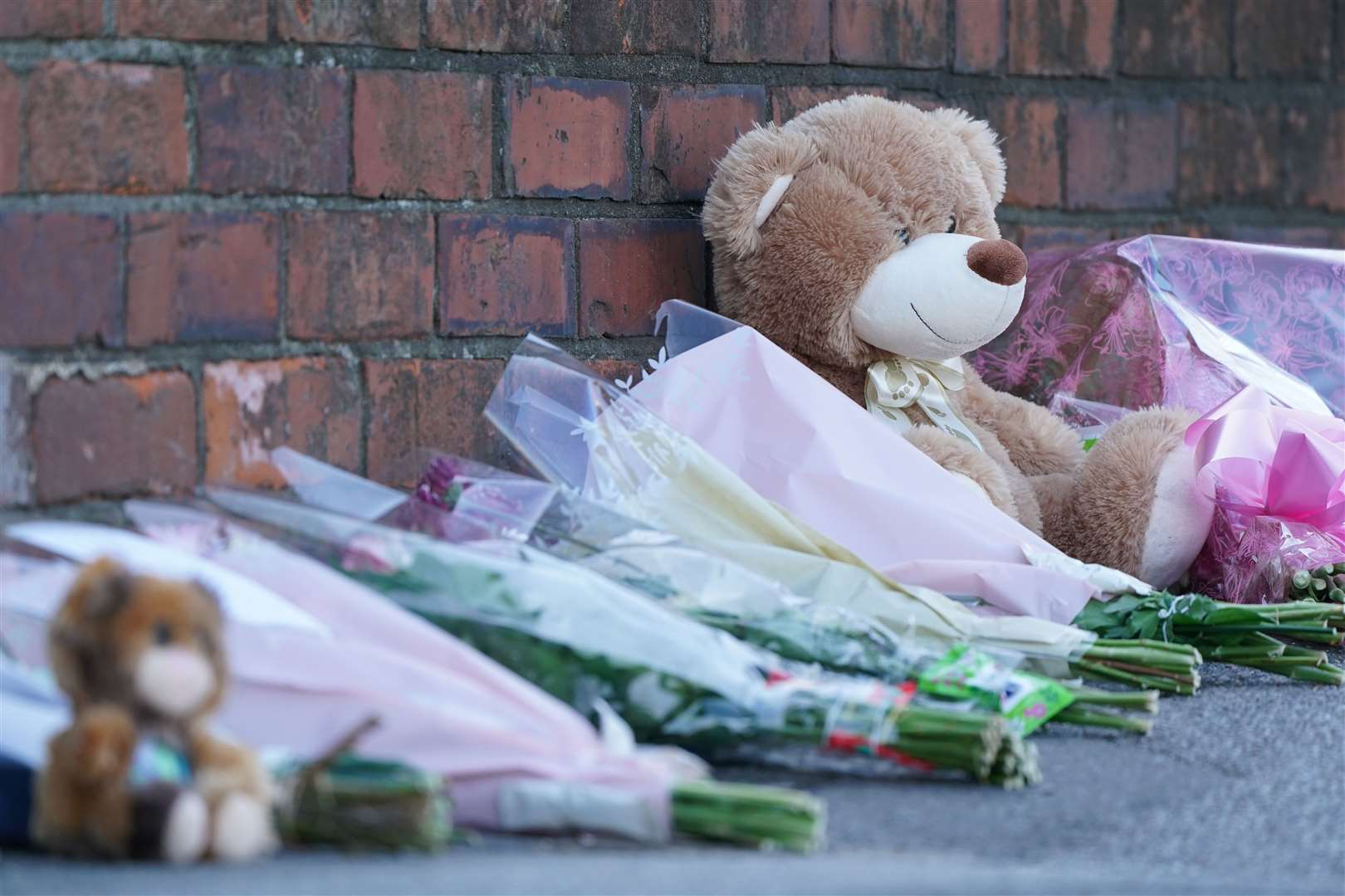 Floral tributes and teddy bears were left at the scene in High Holme Road (Joe Giddens/PA)