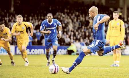 Simeon Jackson strokes home Gillingham's winner from the penalty spot