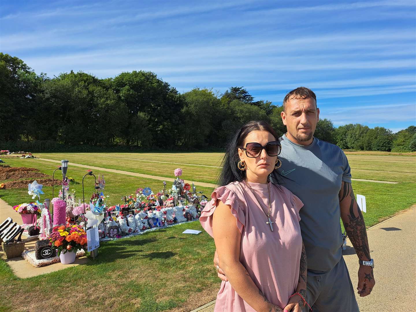 Alisha Ponter's mother Cody Hobman with her husband Aaron at Hawkinge Cemetery