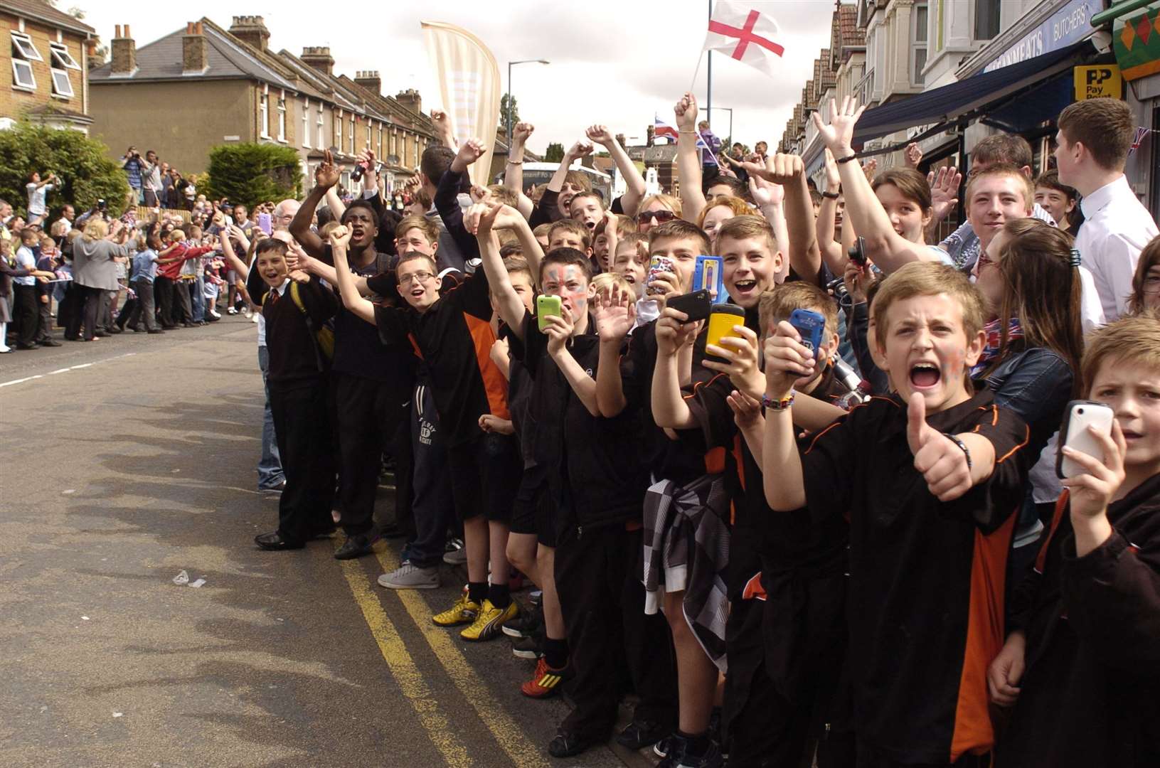 Hundreds packed in at Pelham Road, Gravesend, cheering on the torchbearer