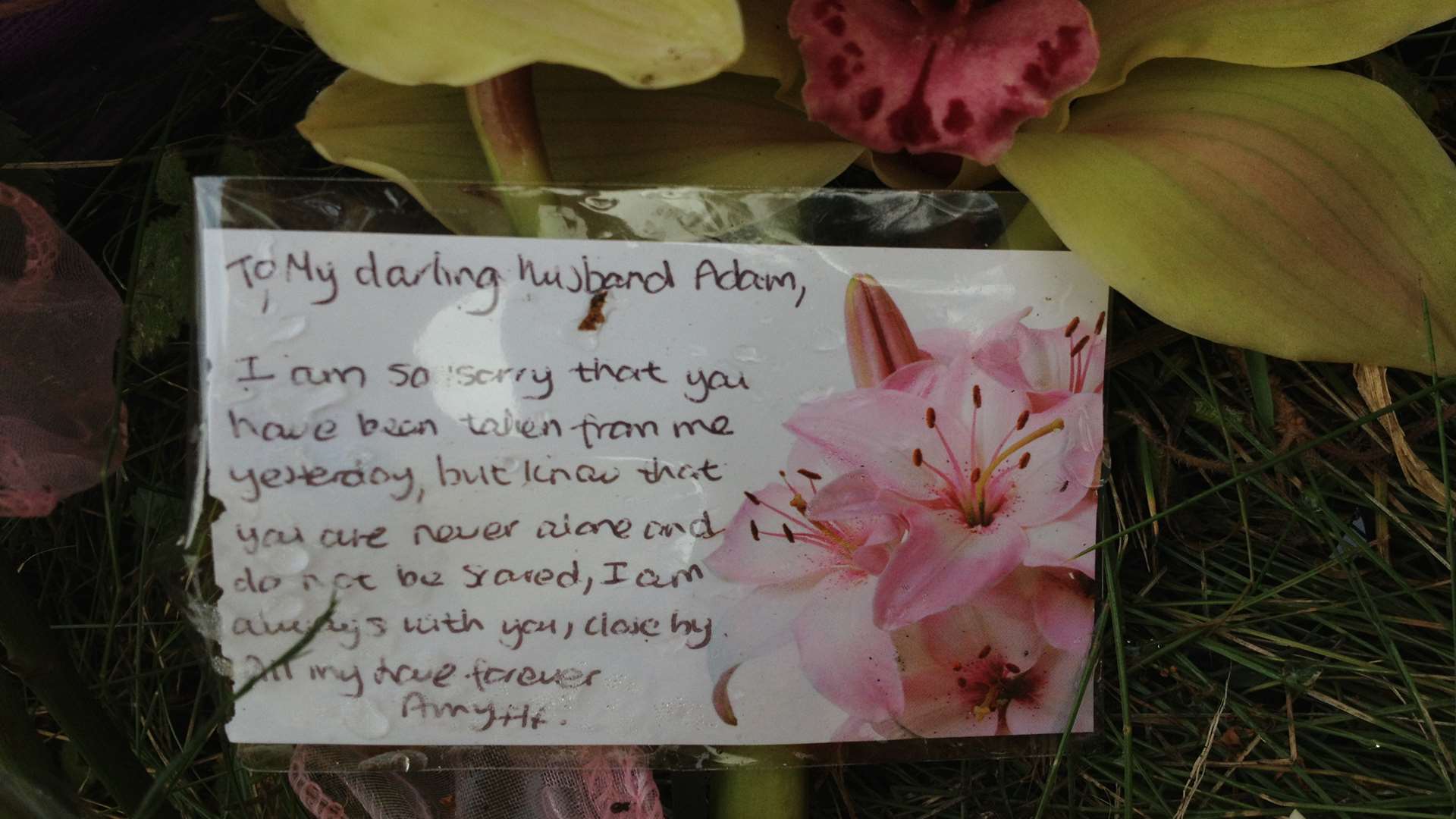 A tribute left at the scene by Adam's wife Amy