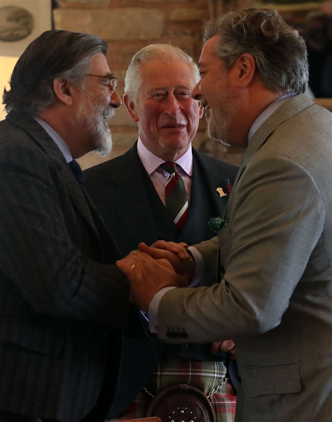 Charles with Lord Thurso and Michael Fawcett (Andrew Milligan/PA)