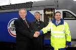 Transport Secretary Geoff Hoon with Jacques Gounnon and the driver of the first train through the tunnel, Ian Miller