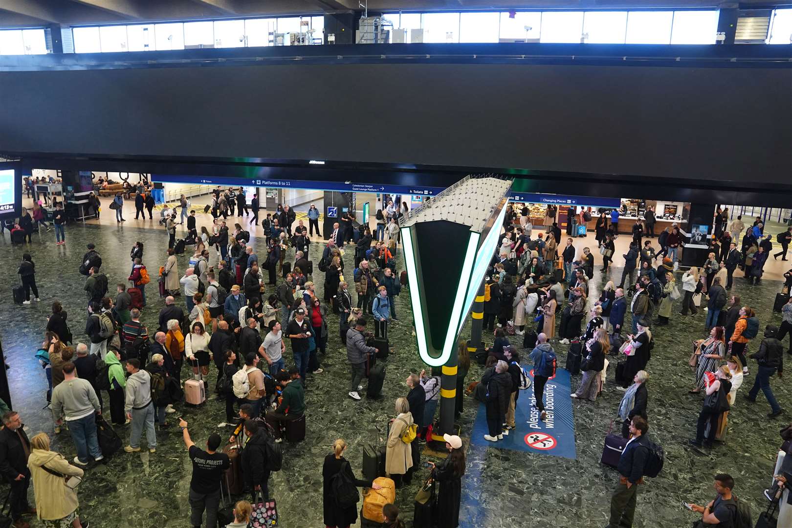 Network Rail had been criticised for converting the main concourse departure board into a large advertising screen (James Manning/PA)