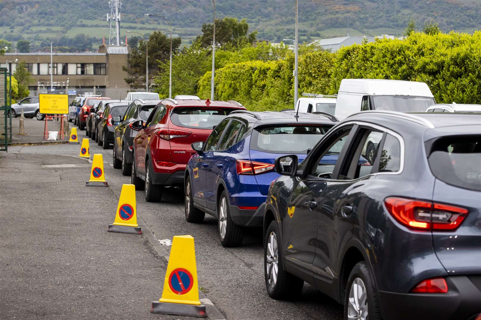 Cars queue waiting to get into Blackstaff Way Recycling Centre in west Belfast whichopened on Monday after an ease on the lockdown. (Liam McBurney/PA)