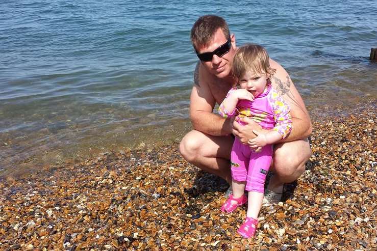 Neil Cogran with his 16 month-old daughter Olivia on Herne Bay beach.