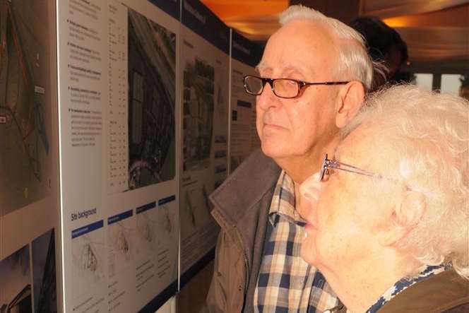 Members of the public examine Roxhill's display