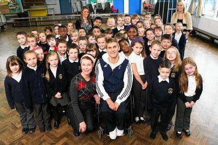 Paralympic wheelchair rugby captain Steve Brown visited Regis Manor Primary School to give a talk to pupils. He is pictured with Year 3 children and Beat Project artist Nikki Dennington