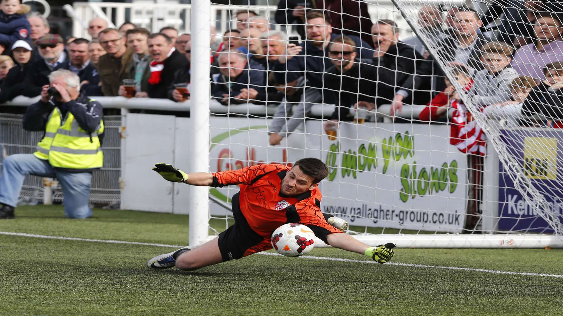Sheppey goalkeeper Dean Warford saves one of the penalties that helped his side lift the Kent Senior Trophy. Picture: Andy Jones