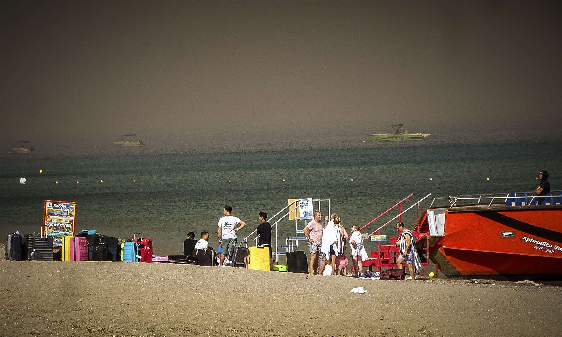 Three coast guard vessels, plus one from the army, were evacuating people from two beaches (Argyris Mantikos/AP)