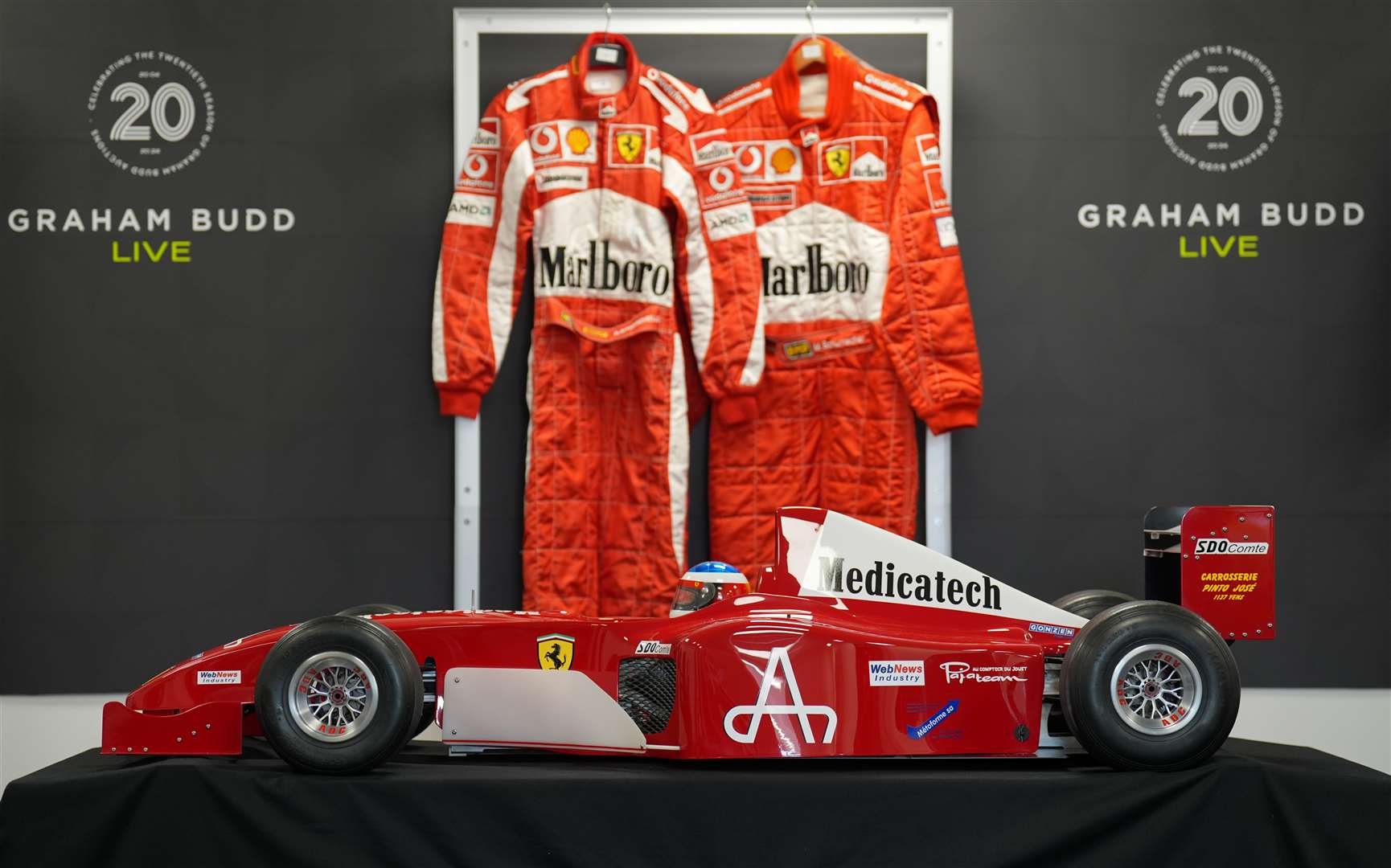 The 1:3 scale model of the F1 Ferrari F2002 will be sold alongside other motor racing memorabilia, including race suits (Joe Giddens/PA)