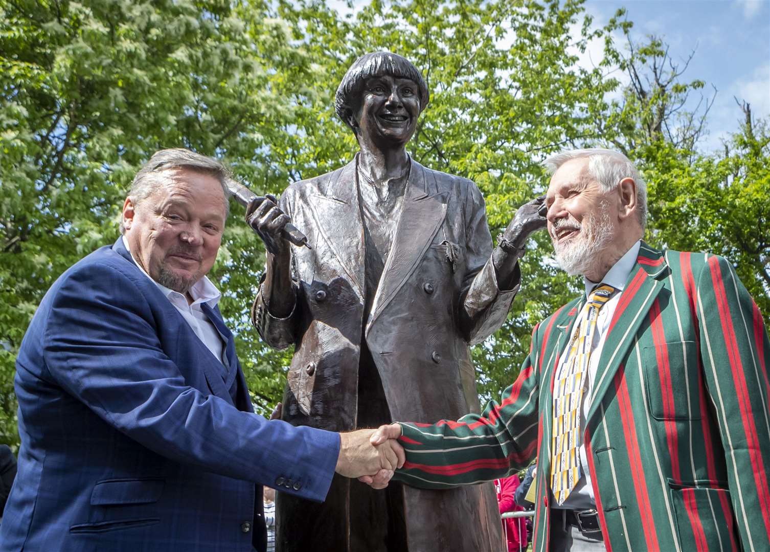 The statue of Victoria Wood was unveiled in 2019 by fellow comedian Ted Robbins, left, and her brother Chris Foote Wood (Danny Lawson/PA)