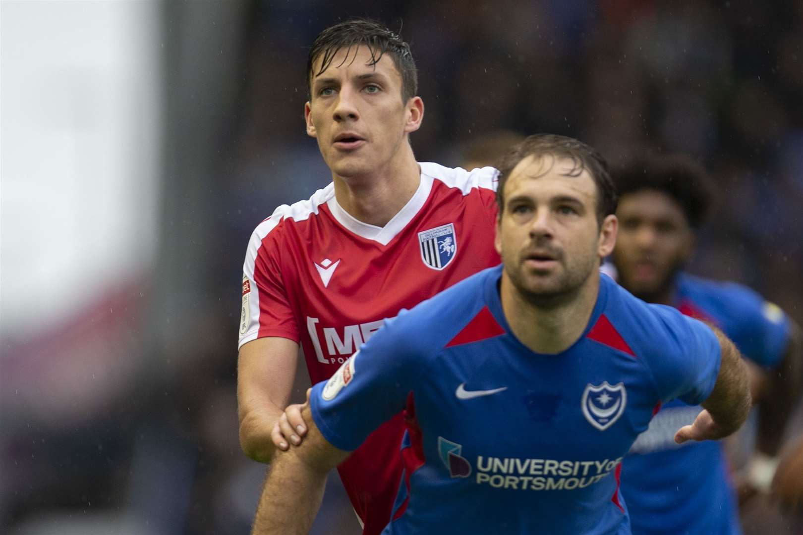 Alfie Jones keeps his man close as the Gills held Portsmouth to a goalless draw Picture: Kent Pro Images (19180338)