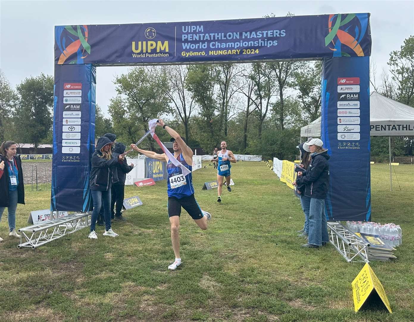 Eddie Crofton-Martin crosses the line at the Modern Pentathlon Masters World Championships.