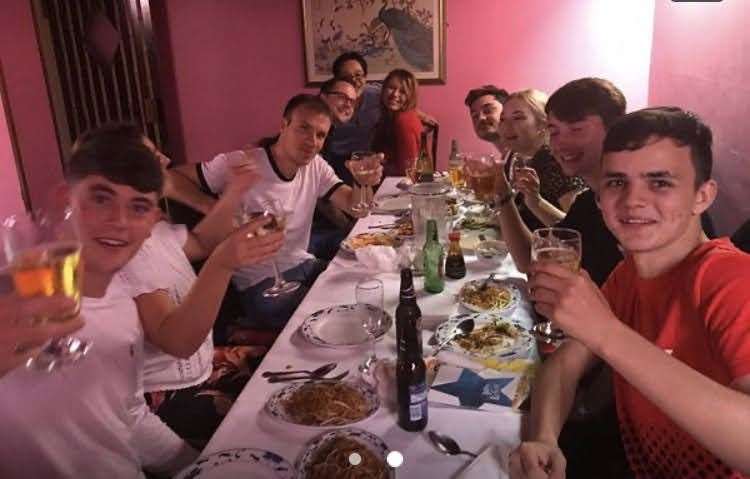 A family enjoy a meal at Hop Kweng. Wai Chiang is pictured at the back. Picture: Wai Chiang