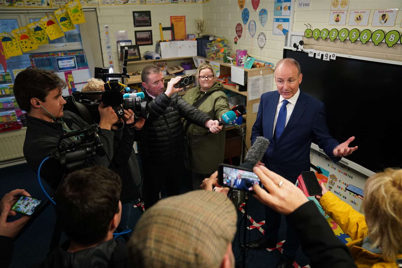 Mr Martin speaking to the media as he casts his vote at St Anthony’s Boys’ School, Beechwood Park, Ballinlough, Cork (Jacob King/PA)