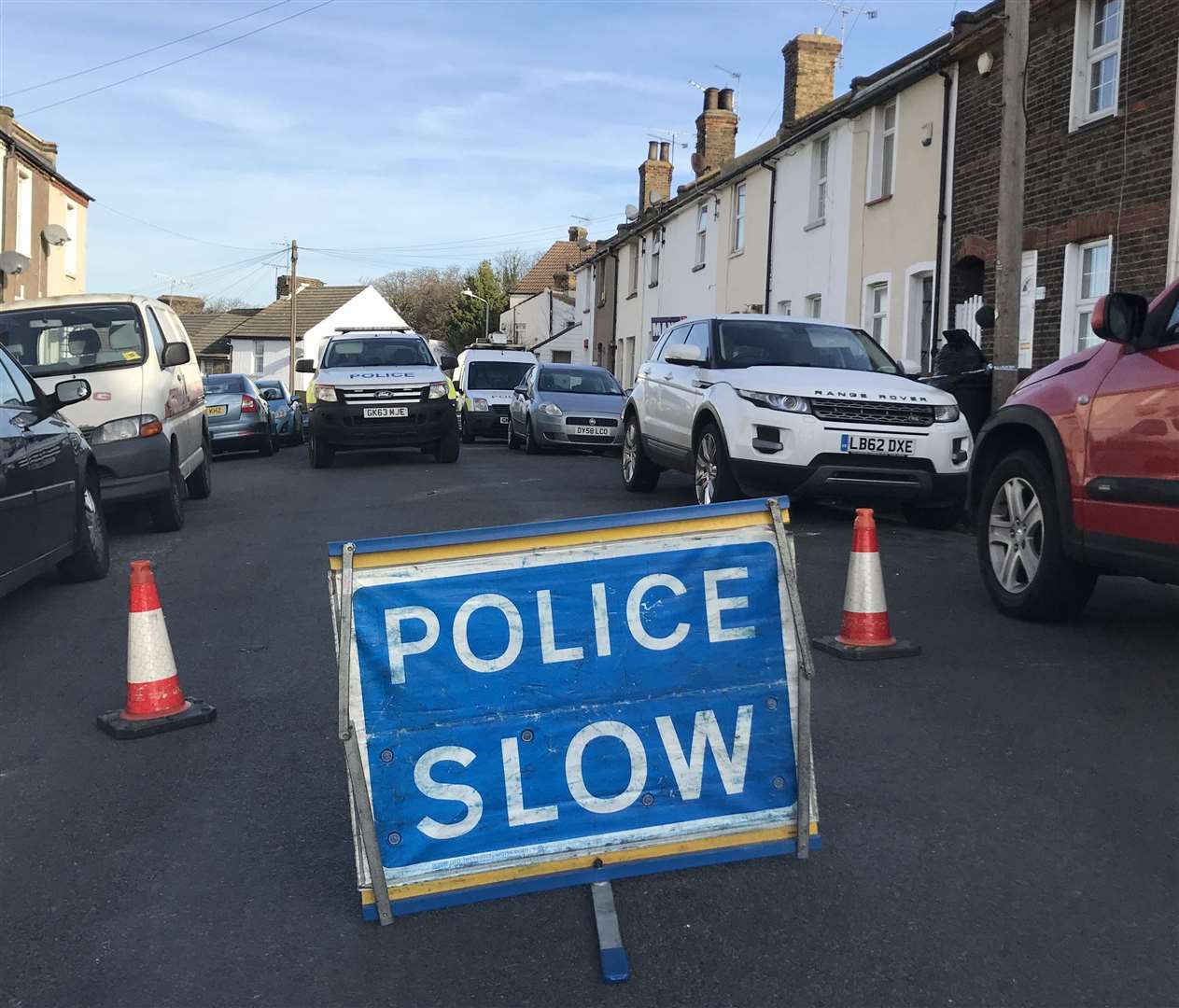 Police in Hamerton Road, Northfleet, the day after