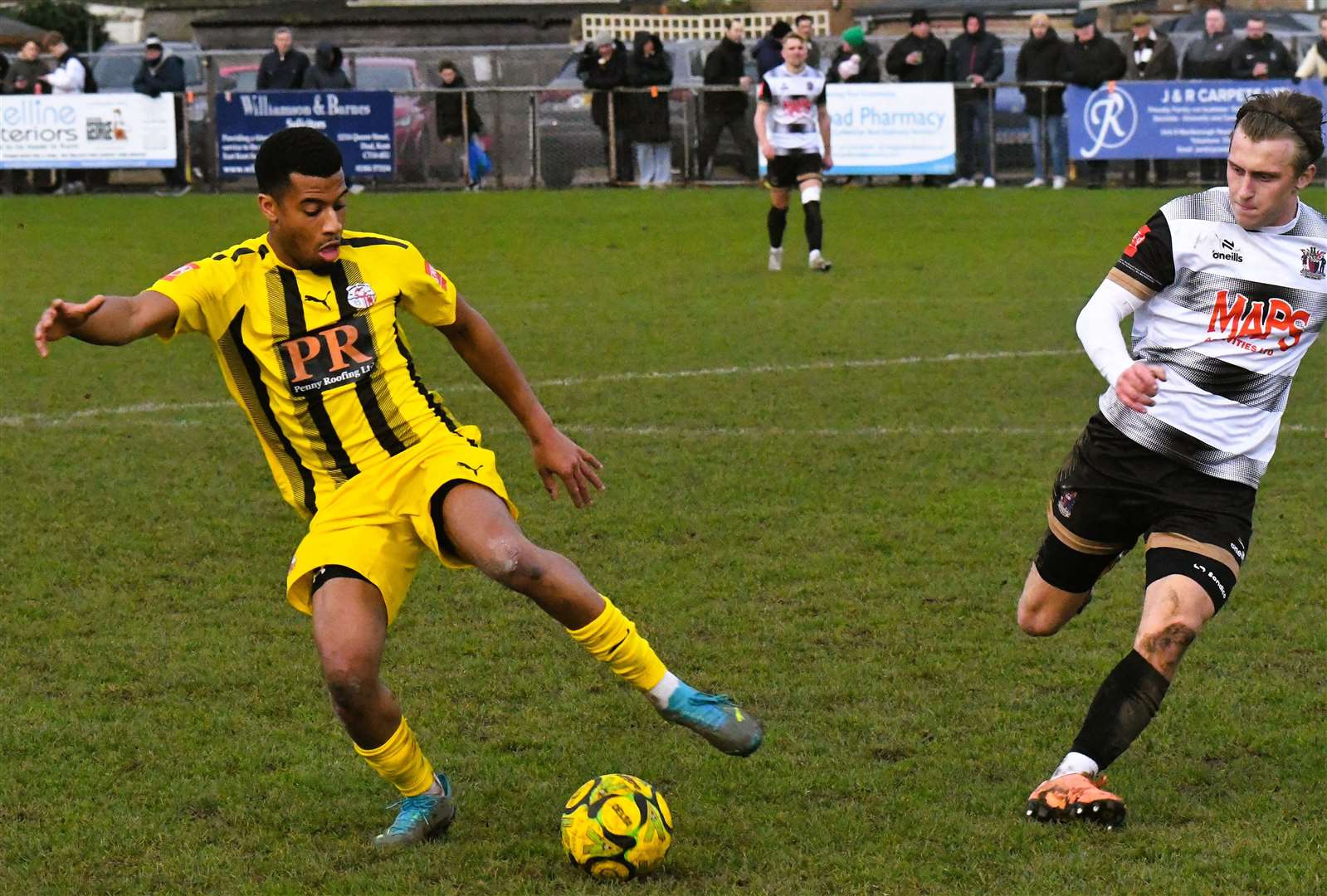 Sheppey defender Mamadou Diallo keeps the ball away from Deal debutant Tommy Lamb. Picture: Marc Richards