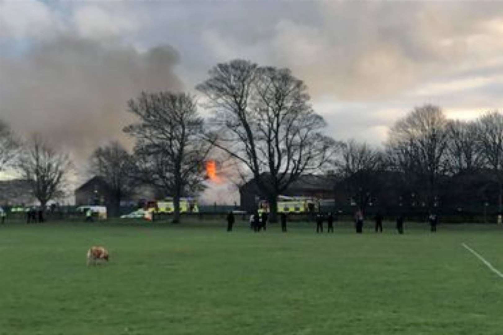 A large fire engulfed one of the camp's buildings, started by asylum seekers protesting conditions