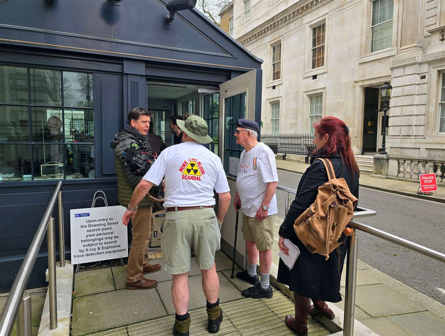 Terry Quinlan and Brian Unthank passing security to enter Downing Street