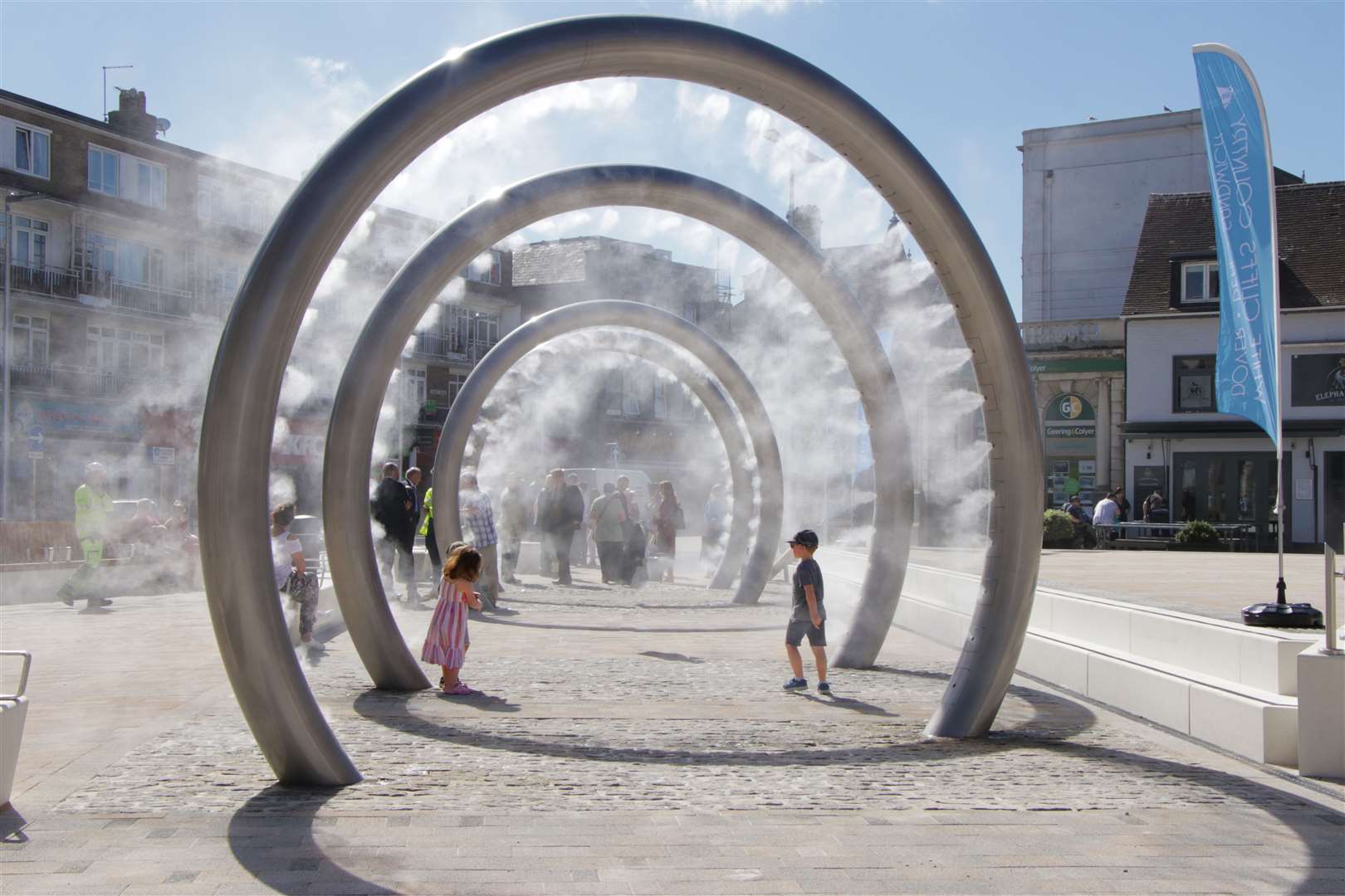 Two children playing in the ringed water feature Picture: Dover District Council