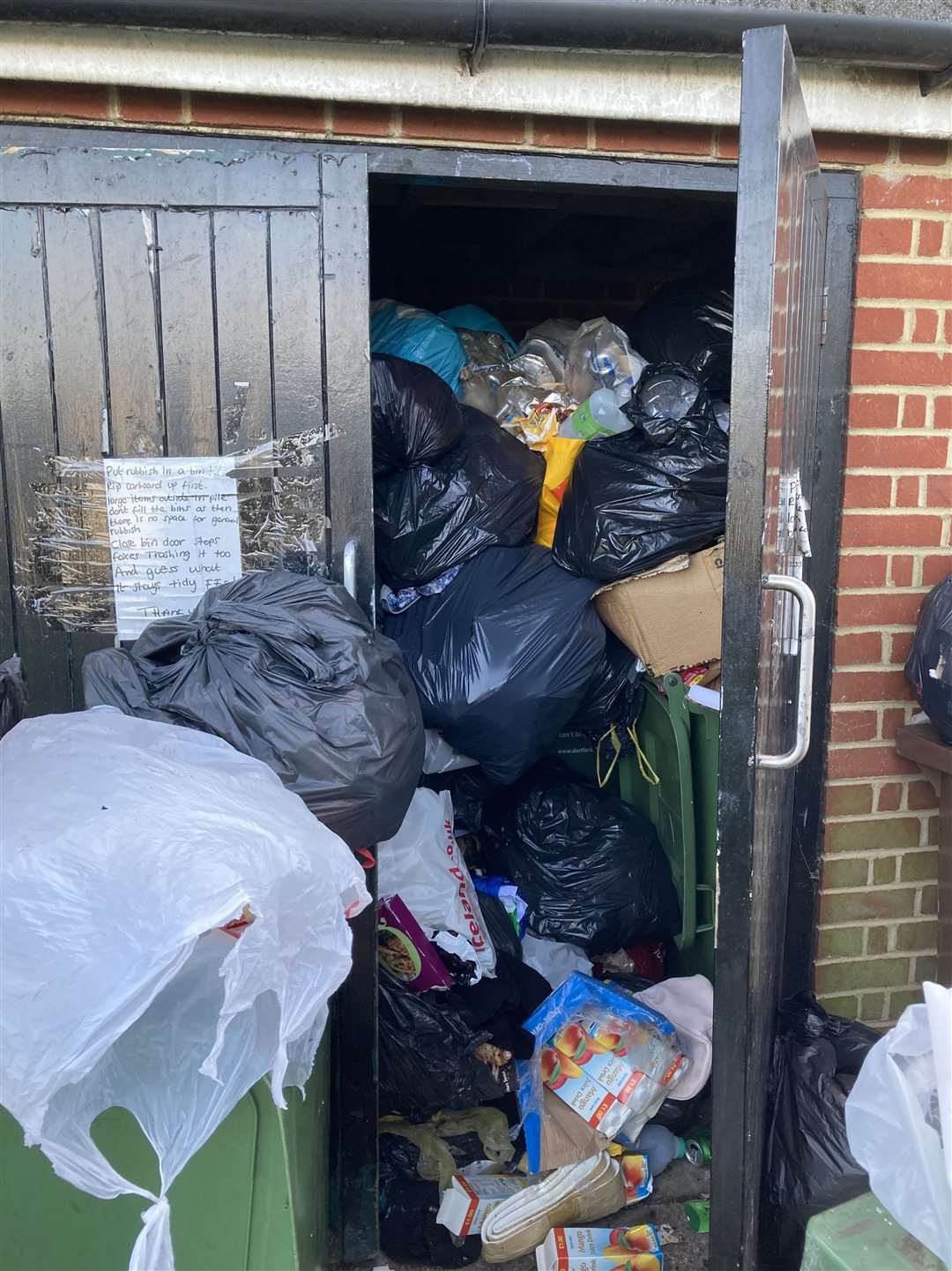 A notice warns neighbours about the risks of foxes getting inside. Photo: Andy Newman