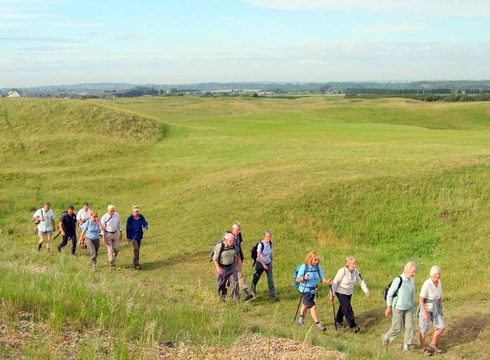Walkers near a golf course in Deal