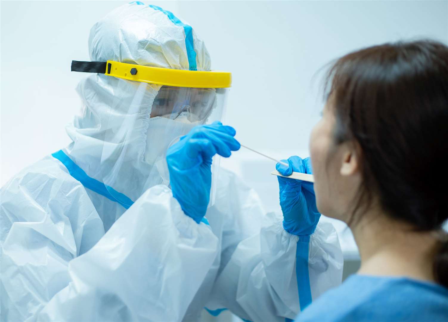 A medical worker taking a throat swab for a coronavirus test. Picture: iStock