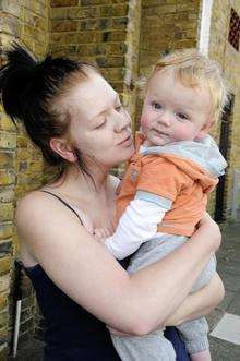 Mum Emily Moseley with Kenziie whose broken pram made him fall and hit his head.