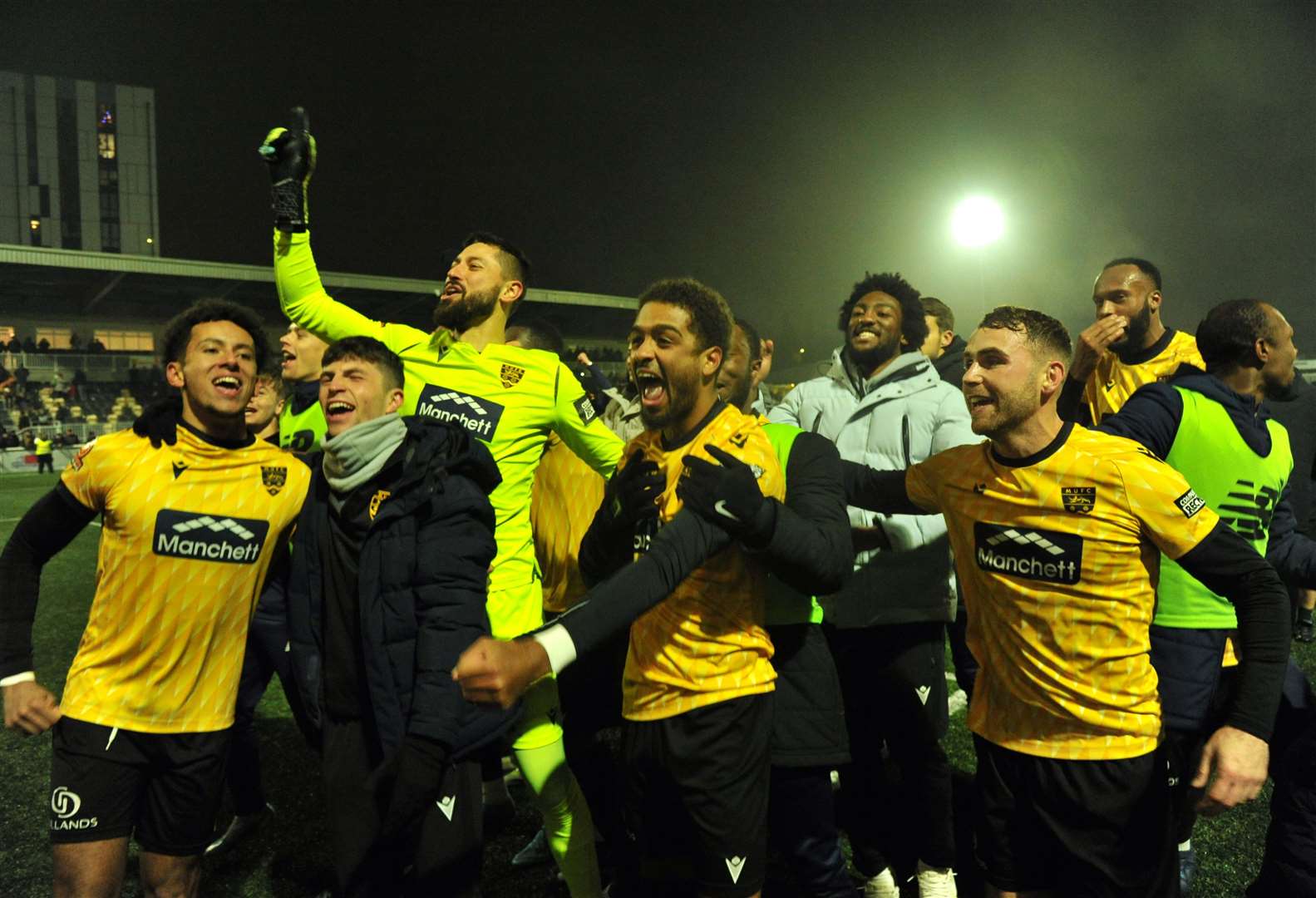 Party time for Maidstone in front of the Genco Stand after beating Barrow 2-1 in the FA Cup second round. Picture: Steve Terrell