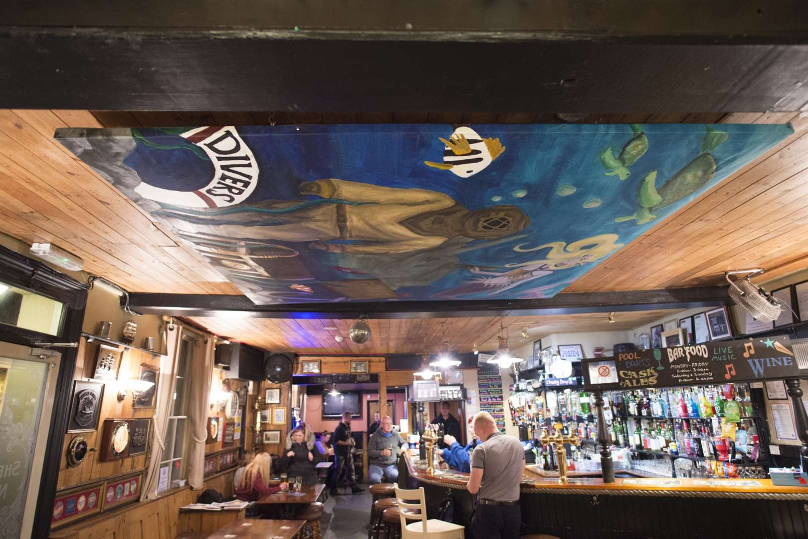 Divers Arms ocean mural suspends from the ceiling