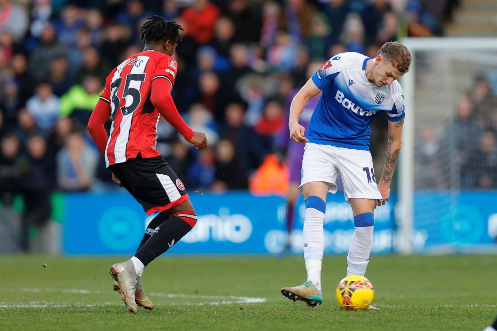 Gillingham’s Ethan Coleman under pressure from Andre Brooks Picture: @Julian_KPI