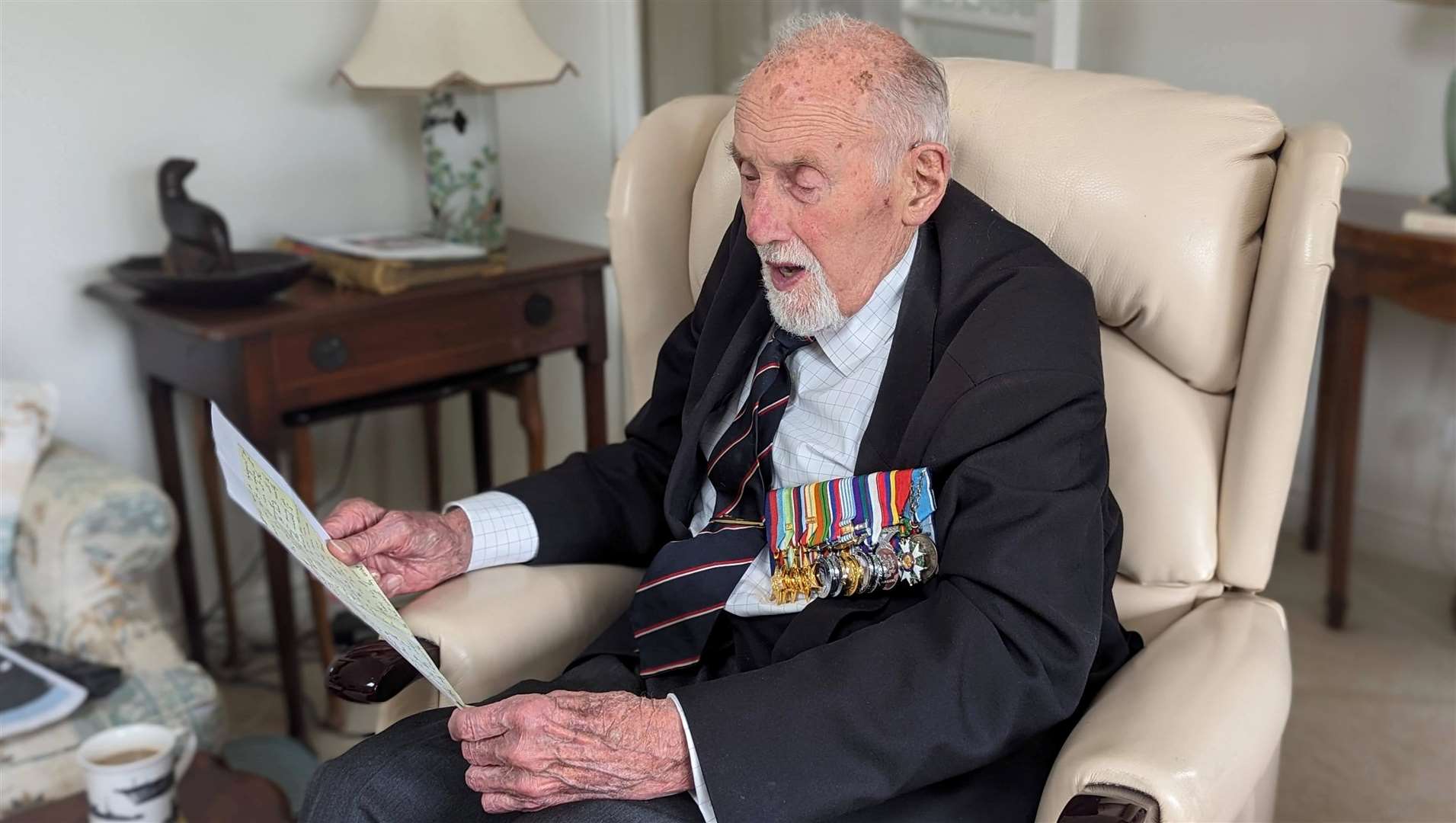 John Roberts, a retired Royal Navy officer from Whitstable, reads one of his wartime letters